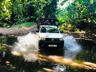 Safari Tropical Tours in Moorea - 4x4 vehicle in the river
